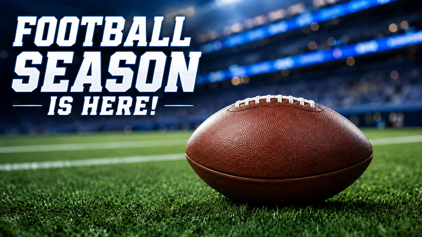 A brown leather American football sits on a green turf field with a blurred stadium in the background. Large white text on the left reads 'FOOTBALL SEASON IS HERE!'.