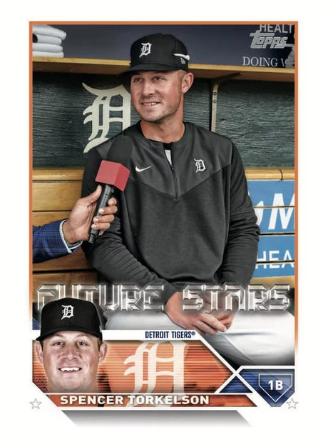 Baseball trading card of Spencer Torkelson in a dugout with a microphone, featuring the Detroit Tigers logo.